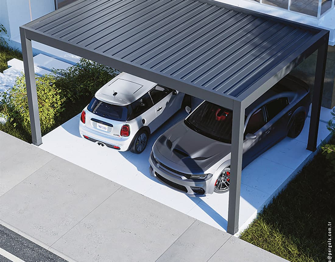 Aluminium carport with a dark frame and a fixed flat panel roof sheltering two cars in front of a modern house